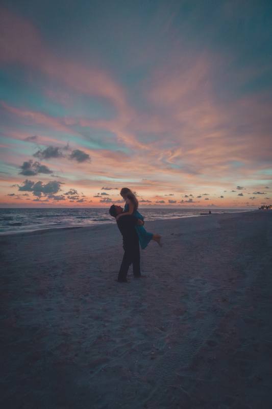 Couple on the beach at sunset
