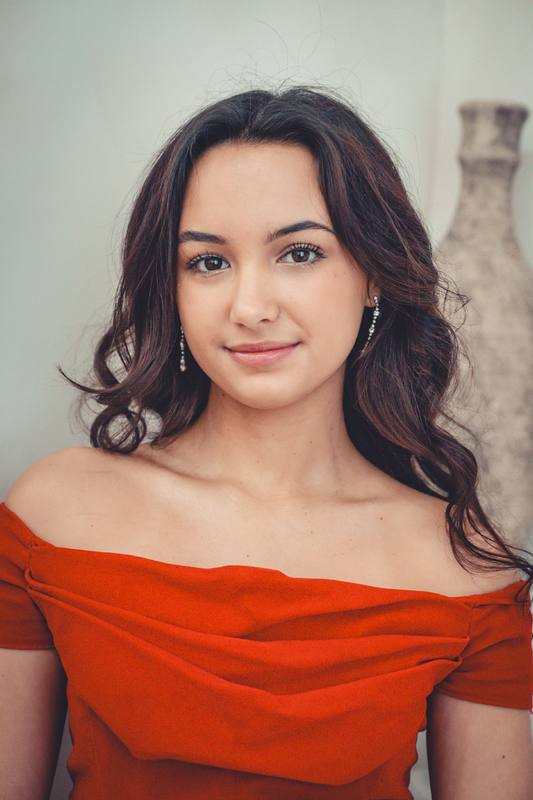 Portrait of a young woman in a red dress