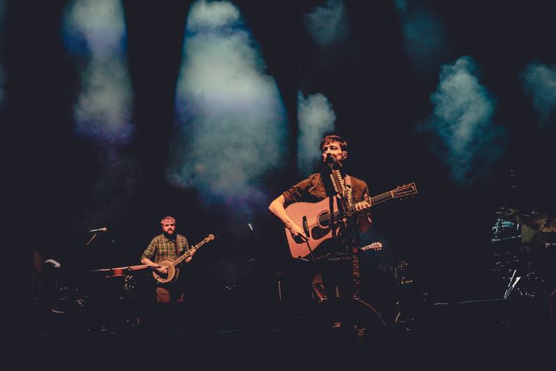 Band performing on a smoky stage